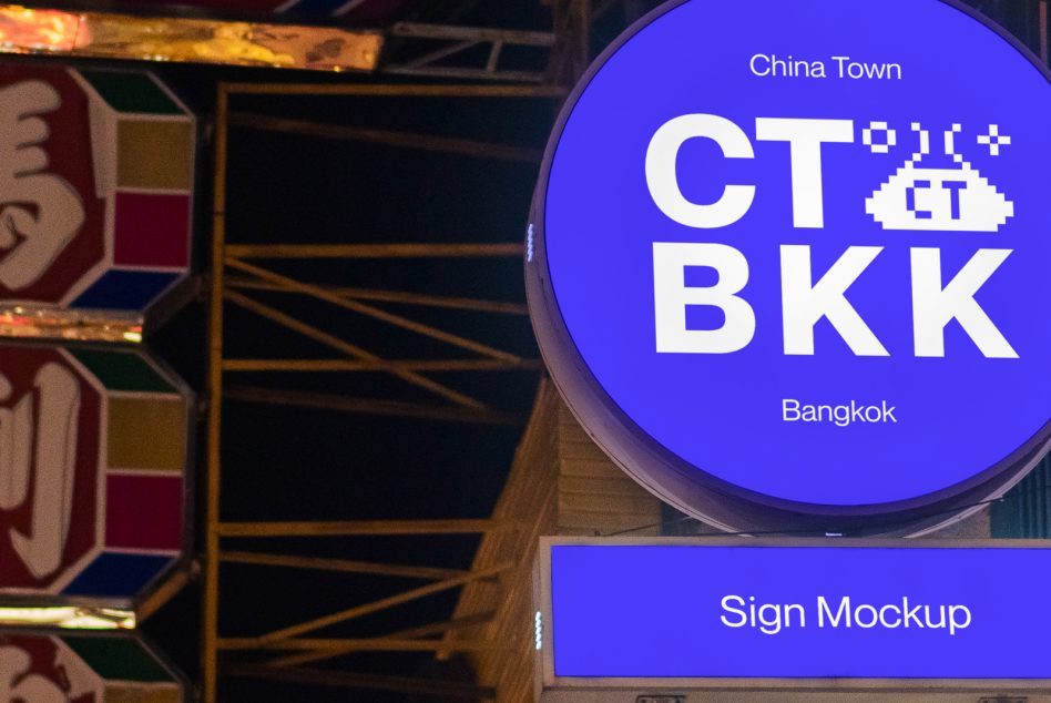 Illuminated circular sign mockup at night displaying text for China Town Bangkok, suitable for designers looking for urban sign graphics.